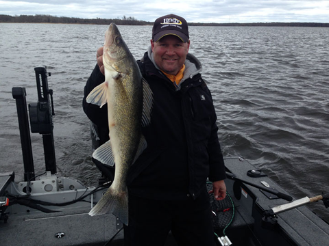 image of Jon Thelen holding large walleye